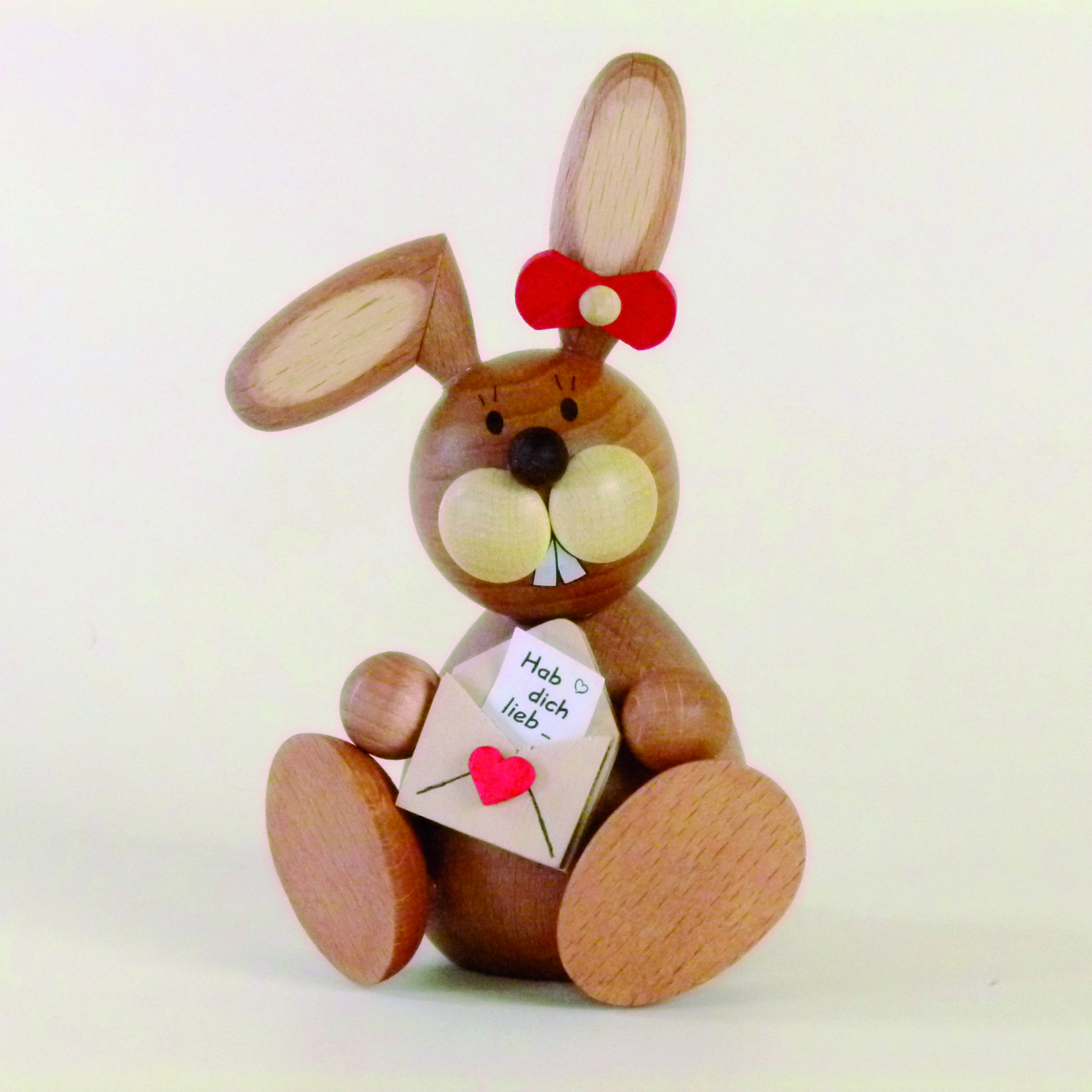 Holzfigur Osterhasen-Frau sitzend mit Brief kaufen