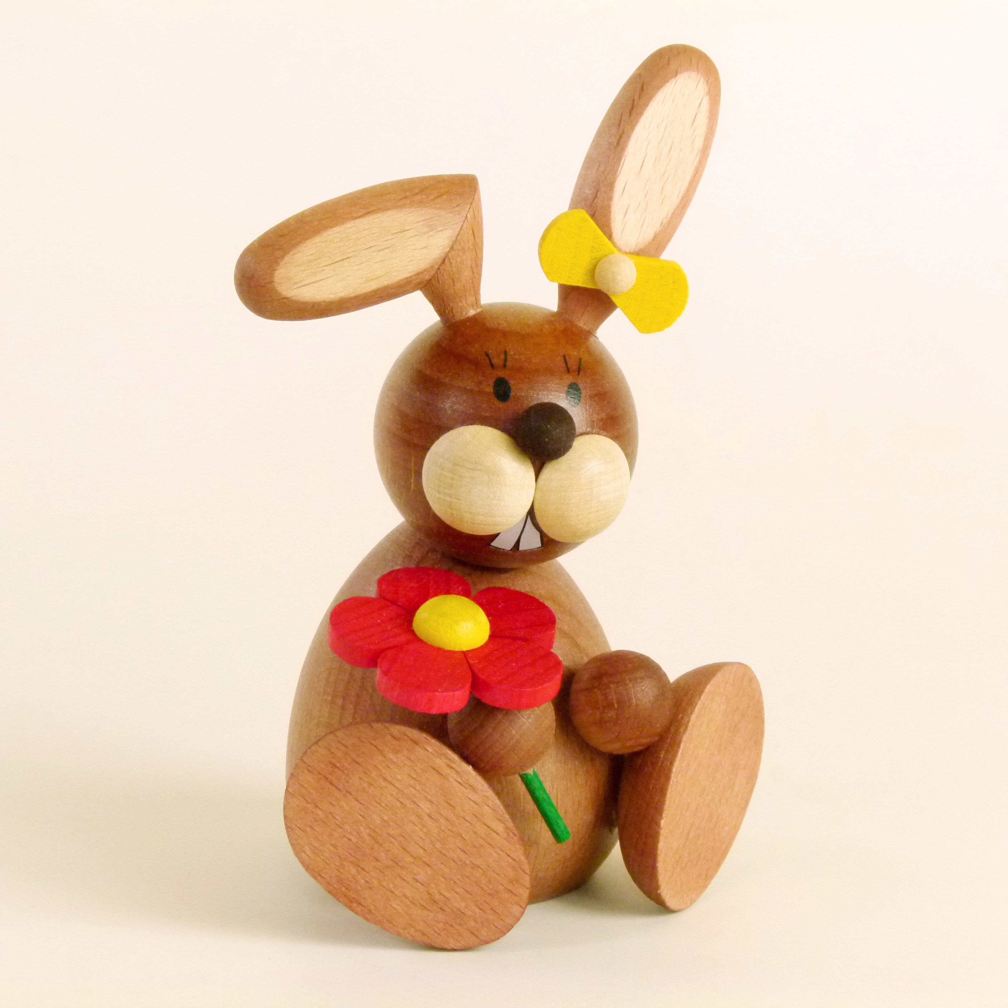 Tischschmuck Osterhasen-Frau sitzend mit Blume kaufen