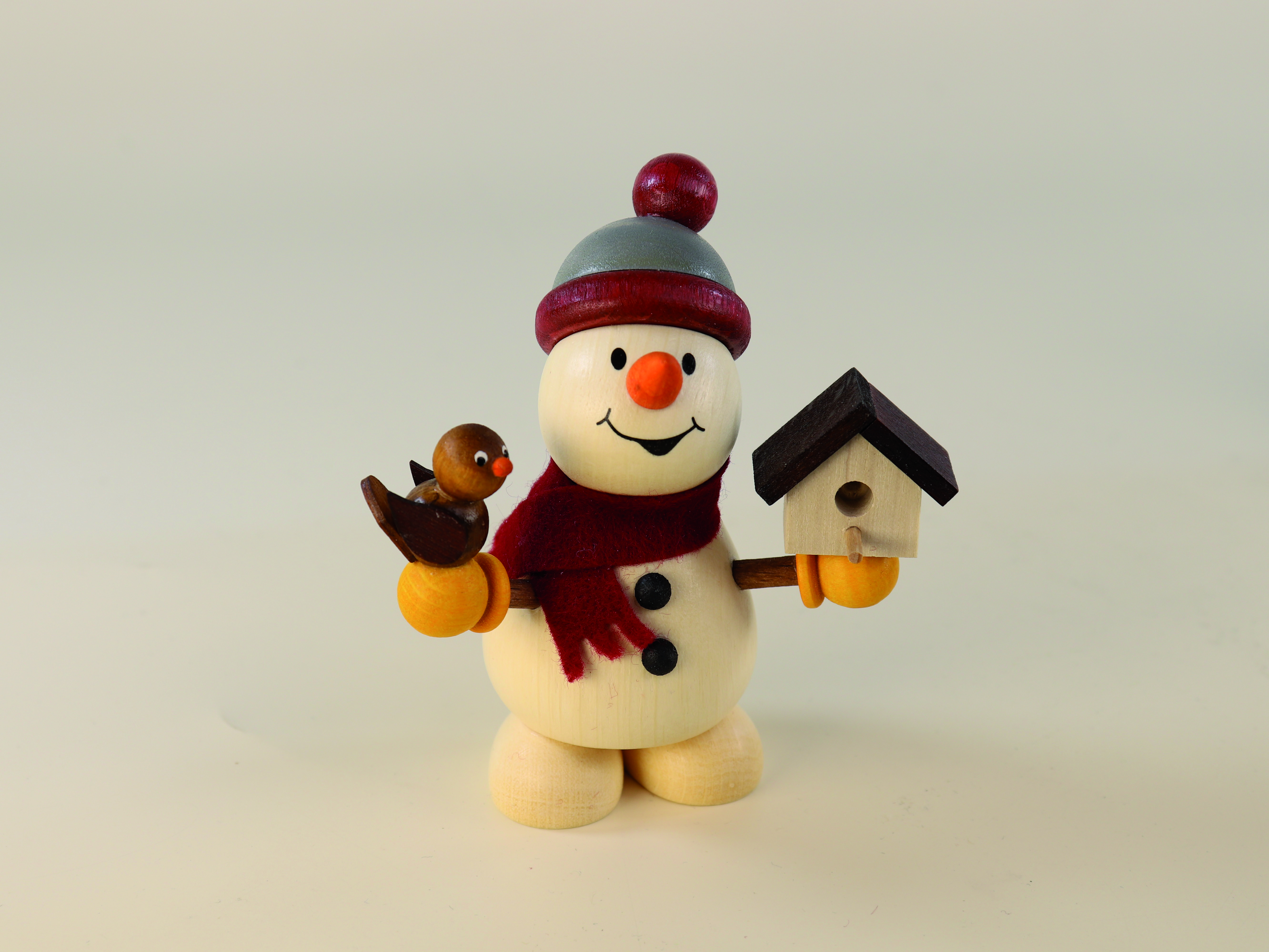 Holzfigur Schneemann mit Vogel und Vogelhaus in den Händen 9,3 cm groß als Tischdeko