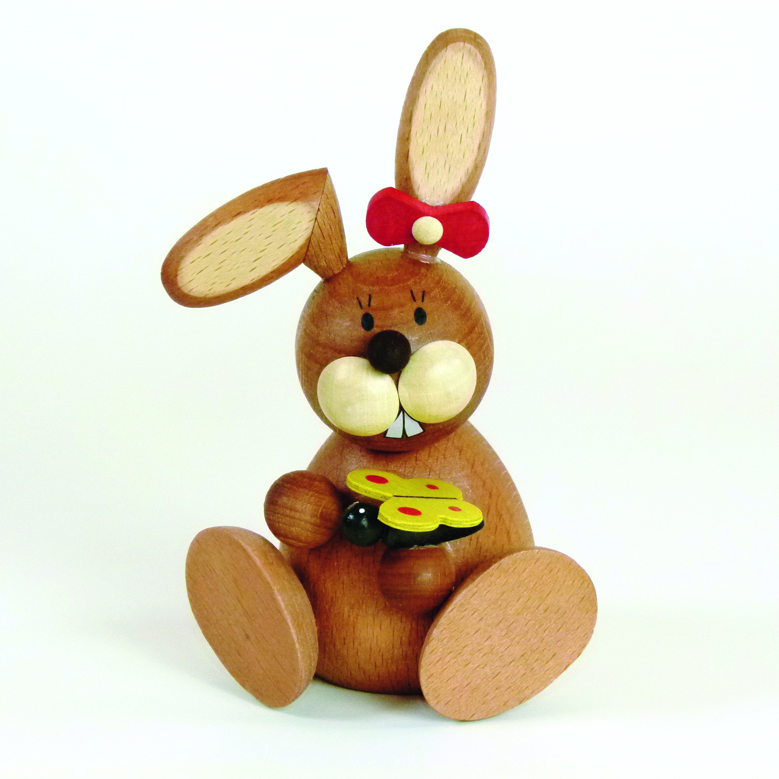 Osterhase Holzfigur sitzend mit Schmetterling und Schleife am Ohr kaufen